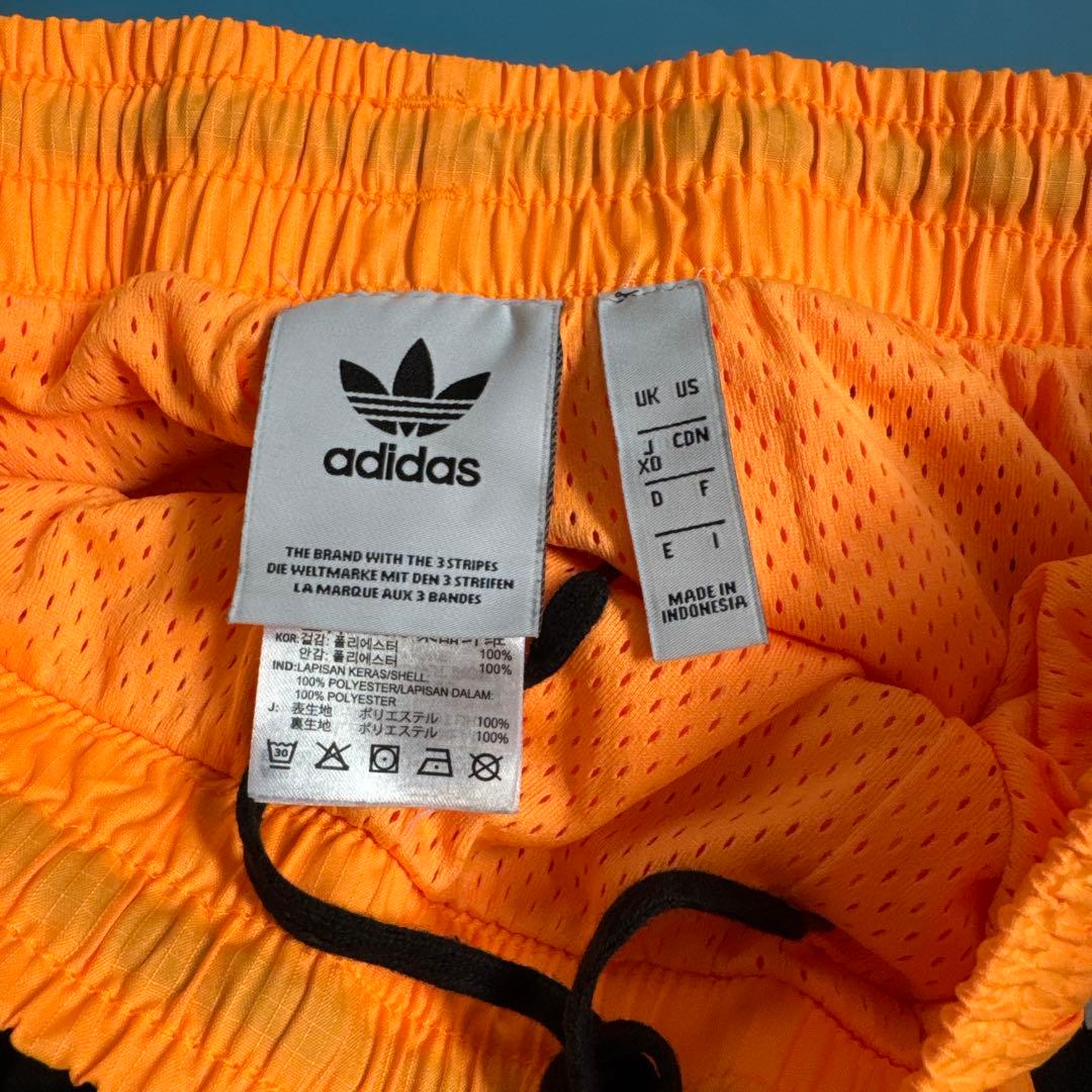 adidas オレンジ・黒 ジャージパンツ XO